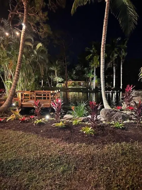 Low lighting at the water's edge on a coastal property at night