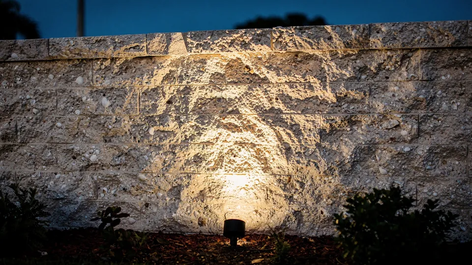 Illustration of a stone wall grazed by one fixture